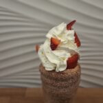 Chimney cake with Fresh Strawberries and Whipped Cream